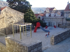 children's playground in front of the building