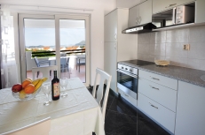 fully equipped kitchen and dining area