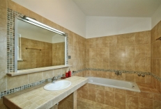 bathroom with bath on 1st floor